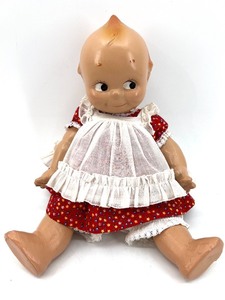 lot 14 image: Vintage 1985 Kewpie Doll with Red Floral Dress and Jamboree First Ribbon