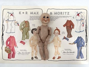 lot 21 image: Vintage Simon & Halbig K & R Max and Moritz Doll with Outfit Sheet