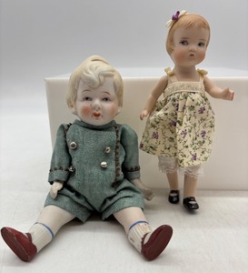 lot 76 image: Set of 2 Bisque Porcelain Dolls in Vintage Clothing