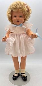 lot 77 image: Vintage Composition Shirley Temple Doll with Pink Dress