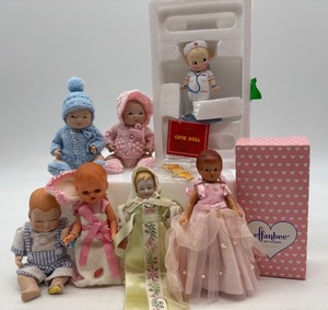 lot 93 image: Lot of 7 Vintage Dolls and Angel of Mercy Figurine with COA