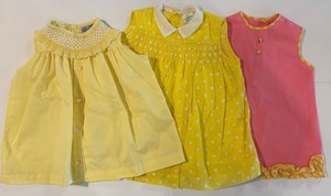 lot 254 image: Collection of 3 Vintage Toddler Dresses in Yellow and Pink