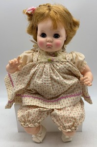lot 103 image: Madame Alexander Puddin Doll with Original Outfit and Box