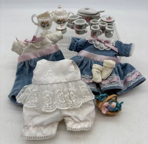 lot 119 image: Antique Vintage Doll Clothing Set with Miniature Porcelain Tea Set
