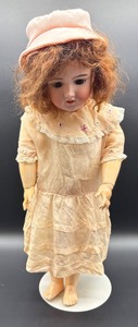 lot 128 image: Antique German Handwerck Bisque Doll with Vintage Dress