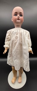 lot 129 image: Antique Kestner Bisque Head Doll with Embroidered Dress