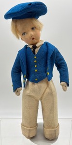 lot 133 image: Vintage Felt Boy Doll with Blue Cap and Coat