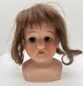 lot 136 image: Antique Bisque Doll Head by Heubach Koppelsdorf with Mocha Wig