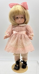 lot 140 image: Armand Marseille Bisque Head Doll in Pink Dress
