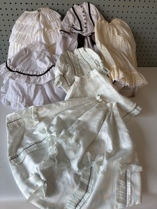 lot 202 image: Collection of Vintage Doll Dresses with Lace and Ribbon Details