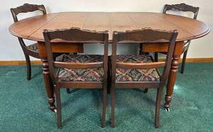 lot 53 image: Antique Drop Leaf Dining Room Table on Wheels and 4 Antique Chairs