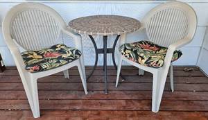 lot 139 image: Wrought Iron and Stone Top Patio Table 28 W x 28.5 H and 2 Chairs 23 W x 35 H x 18 D. 17 Seat Height