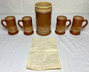 lot 60 image: Vintage Greentown Chocolate GlassCaramel Slag Glass Mug and Smaller Steins