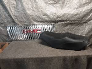 lot 13 image: GMC Chrome Grille and Motorcycle Seat