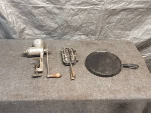 lot 32 image: Vintage Kitchen Tools Collection with Meat Grinder and Pans