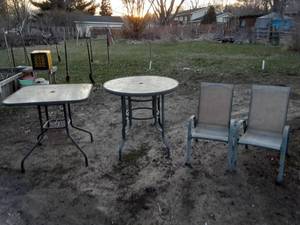 lot 92 image: 2 bar height glass top patio tables and 2 chairs