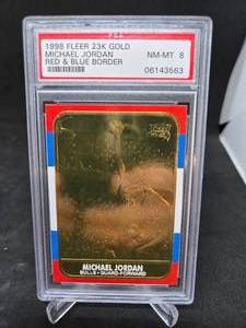 lot 93 image: 1998 Fleer 23KT-Gold Michael Jordan 1986 Rookie Red & Blue Border Graded NM-MT 8