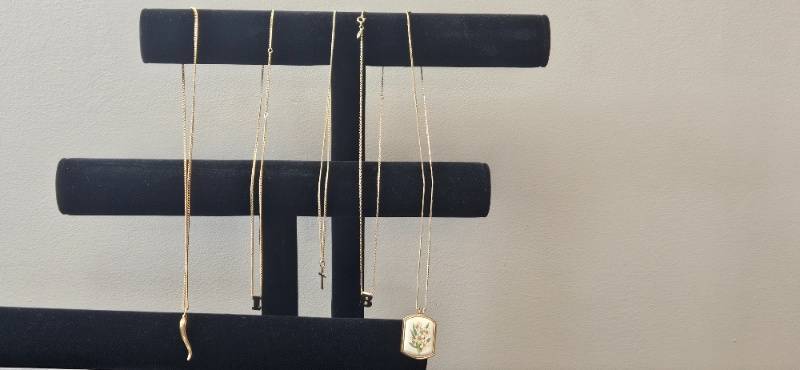 lot 98 image: Collection of Gold-Tone Finish Necklaces with Various Pendants - display not inc