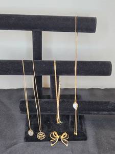 lot 199 image: Collection of Gold-Tone and Enamel Brooch and Avon Necklaces - display not inc
