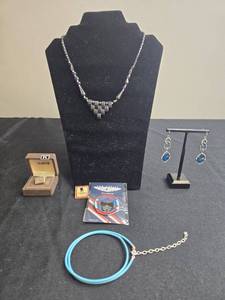 lot 213 image: Set of Jewelry and Collectibles Including Necklaces, Earrings, and Collector Pins - Display not Inc