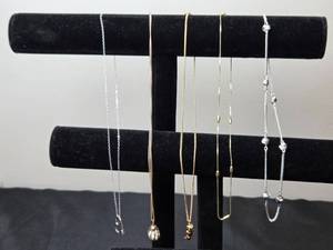 lot 223 image: Collection of Elegant Necklaces Heart Pendant, Pearl Like Cage, and Beaded Designs - display not inc