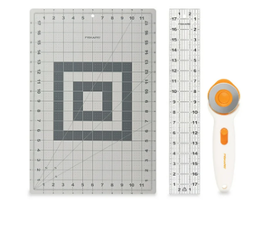 lot 103 image: LOT OF 3 Fiskars 3-Piece Fabric Cutting Set White Rotary Cutter, Gray Cutting Mat, and Acrylic Sewing Ruler