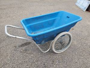 lot 21 image: Large Wheel Barrow Pushes Well Barrel is romovable Will need some Repair