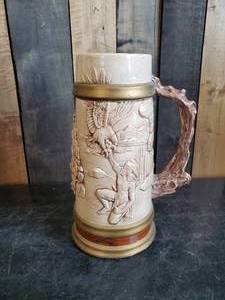 lot 45 image: Gorgeous Large Native American Eagle Stein with Faux Wooden Stick Handle