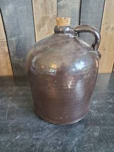 lot 69 image: Large Antique Brown Salt Glaze Stoneware Primative Bee Hive Jug  with Cork