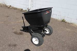lot 13 image: Brinly Tow-Behind Spreader for Lawn Tractors