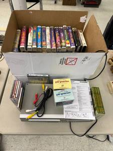 lot 93 image: VCRDVD Player & VHS Tapes