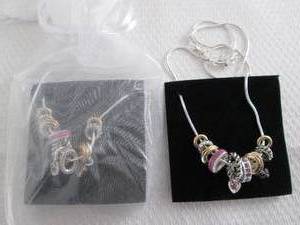 lot 21 image: 2 June Birthstone Charm Necklaces...