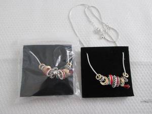 lot 23 image: 2 July Birthstone Charm Necklaces...