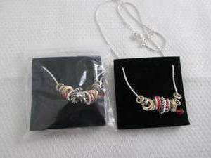 lot 24 image: 2 July Birthstone Charm Necklaces...