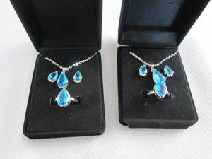 lot 35 image: 2 Dazzling SeaBlue Teardrop Pendant...