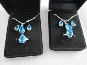 lot 42 image: 2 Dazzling SeaBlue Teardrop Pendant...