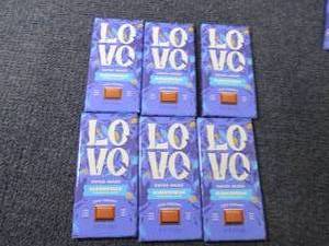 lot 249 image: 6- 2.82 oz Love Almond Chocolate...