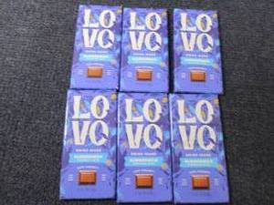 lot 252 image: 6- 2.82 oz Love Almond Chocolate...