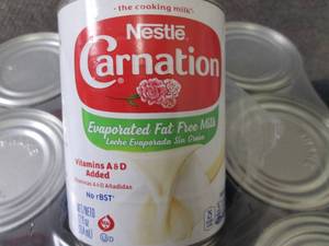 lot 295 image: 12-12 oz Carnation Fat Free Evapora...