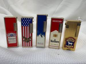 lot 05-C2025 image: 5 Advertising Side Spin Lighters Budweiser, Busch, Marlboro & The White Horse Cellar