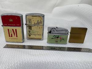 lot 07-C2025 image: 4 Vintage Continental Lighters (2) Zippo Style Chesterfield & L&M Filter (1) Enamel Hummingbird Top Light & Mini Slim Brass Zippo Style