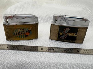 lot 14-C2025 image: 2 1950s Advertising Lighters Drink Hires Root beer by Little Billboard & Stevens Tours by Crown Design