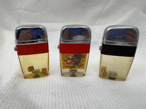 lot 21-C2025 image: 3 Vintage 1960s Lucite See Through Crome Flip Top Lighters (2) Dice and (1) CB Radio  Trucker
