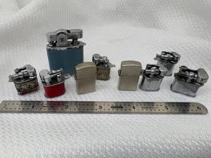 lot 28-2025 image: 9 Micro  Mini Vintage 1950s Lighters (3) EnamelCovers (2) Zippo Style (3) Chrome and (1) Blue Leather