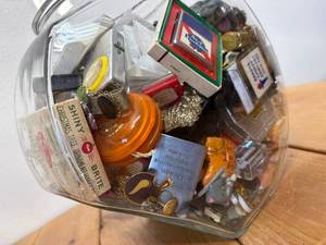 lot 34-C2025 image: General Store Cookie Jar Filled With 100 MCM, Vintage and Retro Smalls Advertising and Other Fun Random Items - Lighters, Rosemeade, Bakelite, Buttons, Keychains, Tape measure, etc