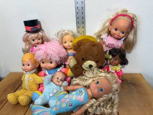 lot 54-C2025 image: 9 Assorted Dolls from 1960s - 1990s - Smokey the Bear, Rollerblade, Mermaid, Fisher Price