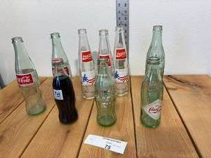 lot 75-C2025 image: 9 Vintage Assorted Coke Bottles (3) Celebrate the Century Mount Rushmore, (1) Crazy Horse