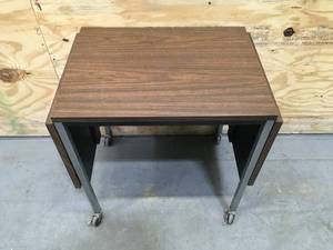 lot 117 image: Small Brown Table on Casters