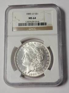 lot 8 image: 1885-O MS64 NGC Morgan Dollar