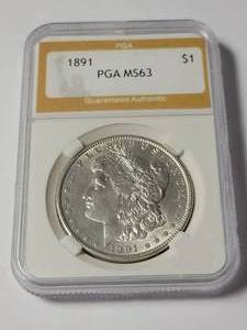 lot 12 image: 1891 PGA MS63 Morgan Dollar